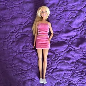 Barbie doll in pink velour set